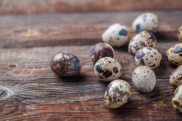 Image showing Group of quail eggs on thewooden background