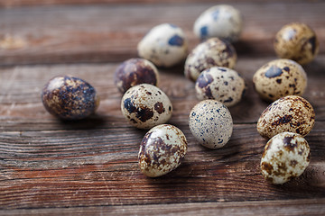 Image showing Group of quail eggs on thewooden background