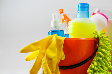 Image showing Bucket with cleaning items on light background