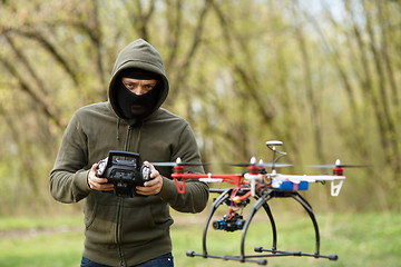 Image showing Man flying with the drone
