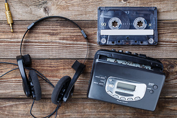 Image showing Music concept. Top view of cassette tape, audio player and headphones.