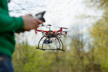 Image showing Man controling a drone.