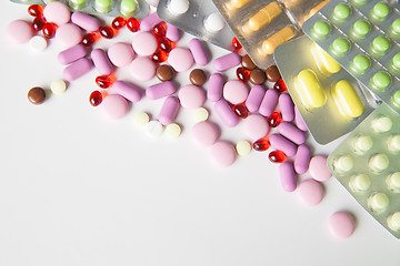 Image showing Colorful tablets on white background