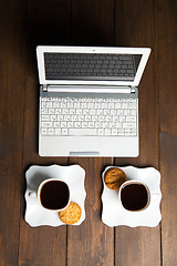 Image showing Morning coffee for two and laptop