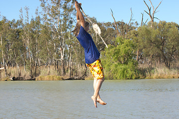 Image showing teenager swinging