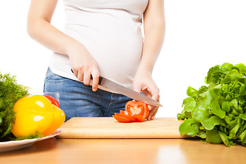 Image showing Unrecognizable woman cutting tomato