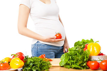 Image showing Pregnant woman with tomato