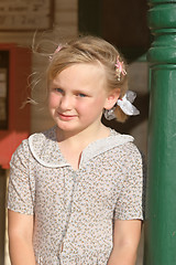 Image showing girl leaning on pole