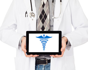 Image showing Doctor holding tablet - Caduceus symbol