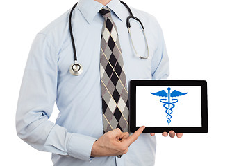 Image showing Doctor holding tablet - Caduceus symbol