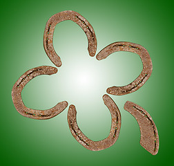 Image showing Horseshoes forming a clover leaf