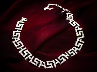 Image showing Necklace at Red Fabric