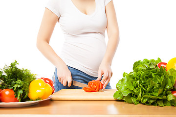 Image showing Unrecognizable woman cutting tomato