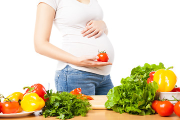 Image showing Pregnant woman with tomato