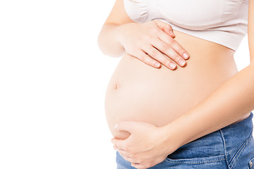 Image showing Unrecognizable pregnant woman embracing her belly