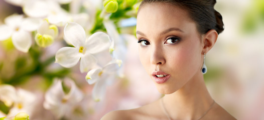 Image showing close up of beautiful woman face with earring