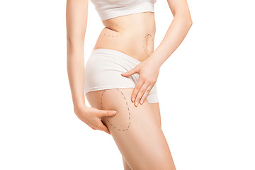 Image showing Woman with outlines for plastic surgery on body