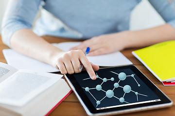 Image showing close up of woman with molecule on tablet pc