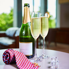 Image showing bottle of champagne and two glasses on the table