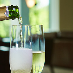 Image showing Champagne pouring in two glasses