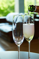 Image showing Champagne pouring in two glasses