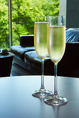 Image showing two glasses of champagne with a tray cheese