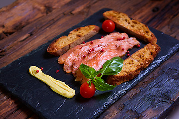 Image showing salmon slices and tomatoes