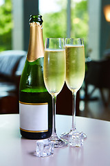 Image showing bottle of champagne and two glasses on the table