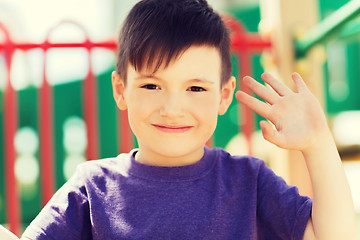 Image showing happy little boy climbing on children playground