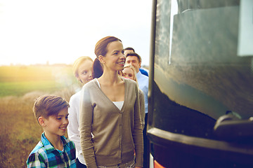 Image showing group of happy passengers boarding travel bus