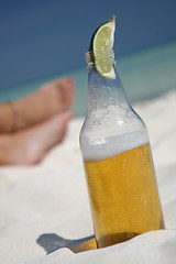 Image showing Beer and Feet on the Beach