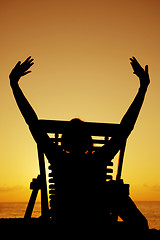 Image showing Beer and Deckchair sunset silhouette