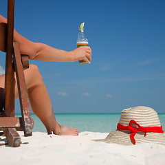 Image showing Beer and Legs on the Beach