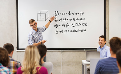 Image showing group of students and teacher at white board