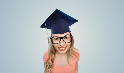 Image showing smiling young student woman in mortarboard