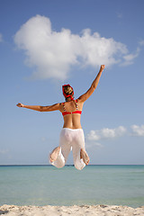 Image showing Woman jumping on the Beach