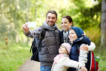 Image showing family taking selfie with smartphone in woods