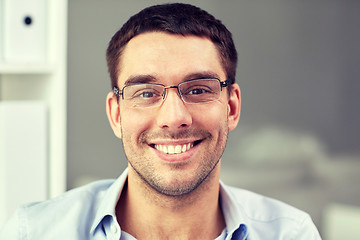 Image showing portrait of businessman in eyeglasses at office