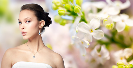 Image showing beautiful asian woman with earring and pendant