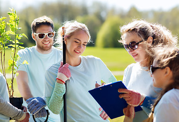 Image showing group of volunteers planting trees in park