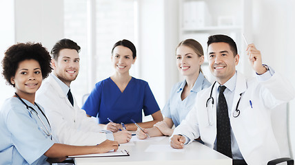 Image showing group of happy doctors on conference at hospital
