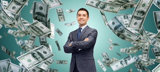 Image showing happy businessman over dollar cash money rain