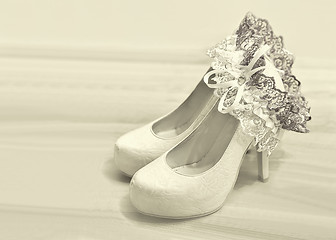 Image showing Wedding shoes and garter of bride