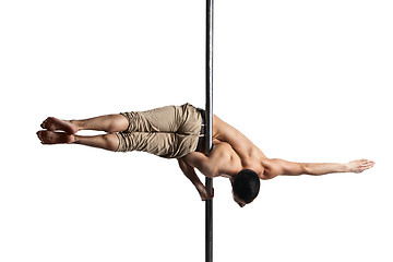 Image showing Young strong pole dance man isolated