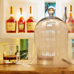 Image showing Guatemalan rum under a glass dome