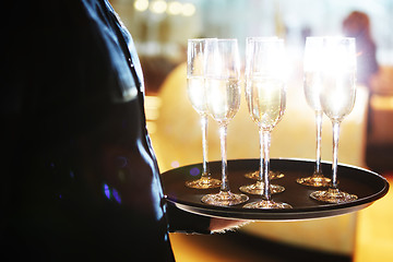 Image showing Waiter serving champagne on a tray