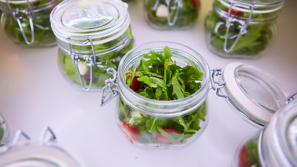 Image showing vegetable salad in glass jar on white background