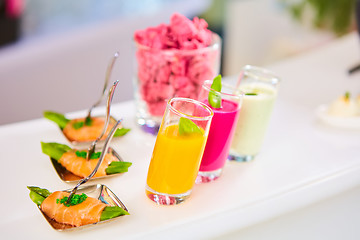 Image showing Appetizer plate of sauteed asparagus wrapped in thin slices smoked salmon