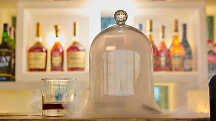 Image showing Guatemalan rum under a glass dome