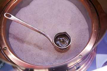 Image showing Preparation of Turkish coffee in the cezve in the sand